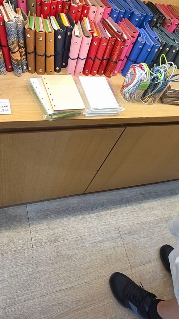 Diary covers and refill pages lined up at a Euljiro diary shop