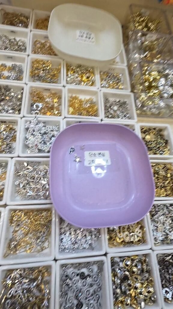 Trays of charms and decorating supplies at Dongdaemun Market